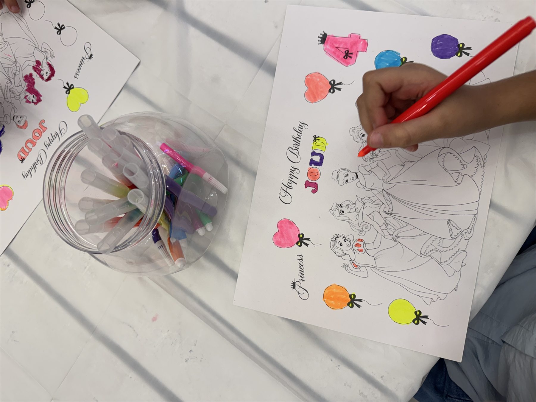 Children colouring at the Kidkit kiosk
